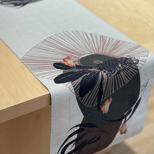 Geo Finch table runner with orange-accented finches among black organic shapes and fine geometric lines